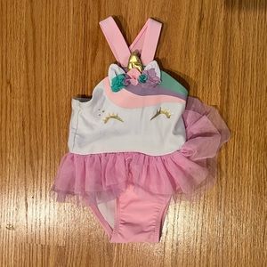 Unicorn baby swim suit, runs small